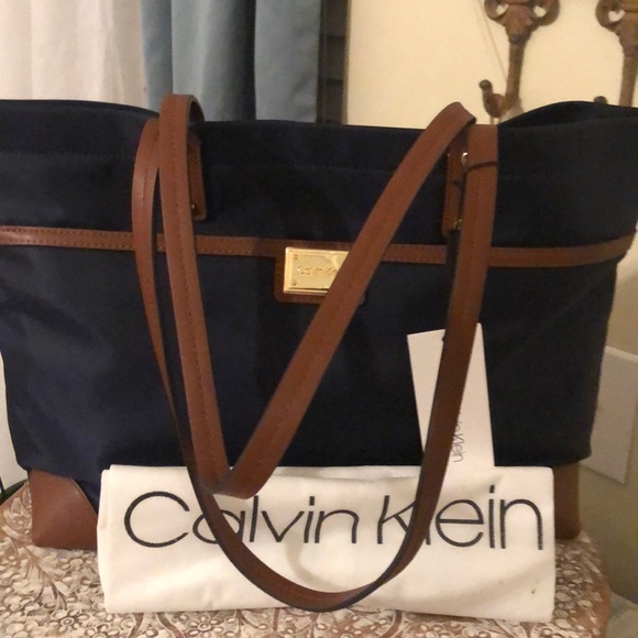 Calvin Klein Handbags - NWT Calvin Klein navy/brown satchel
